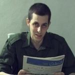 In this screengrab made available by Hamas on Oct. 2, 2009, captured Israeli soldier Gilad Shalit is seen holding a Palestinian newspaper dated September 14, 2009.